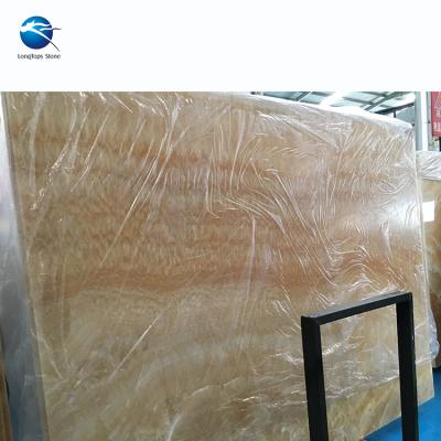 China Modern Yellow Honey Onyx Translucent Marble Tile Wall Cladding Slab for sale