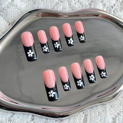 China Design Tip French Press On Nails Long Pink And Black With White Flower Design Full Cover Artificial Handmade Nails for sale