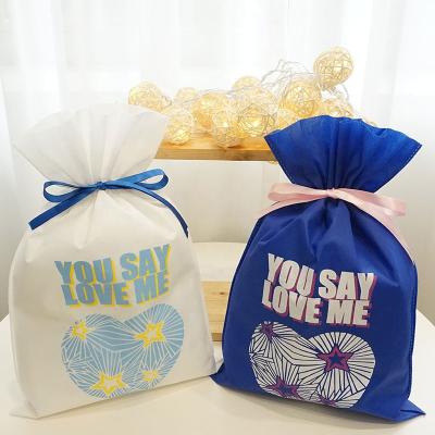 China Promotion 20gsm white blue price non woven eco-friendly non woven cheap wedding favors gift package bag for sale