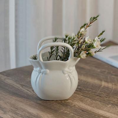 China Newest Design Contemporary Creative Bone China White High Grade Porcelain Table Basket Vase Filler Container for sale