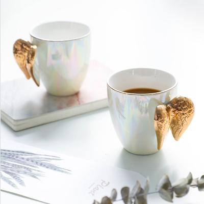 China Viable Hot Selling Creative Angel Wing Mugs Pearl White Ceramic Gold Coffee Mugs Cute Tea Cup Milk Drinkware Unique Gift For Friends for sale