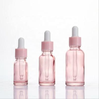 China Cosmetic Luxury Pink Glass Bottle Rose Gold Essential Oil New Product Hair Oil Dropper Bottles 5ml 10ml 15ml 20ml 30ml 50ml 100ml for sale