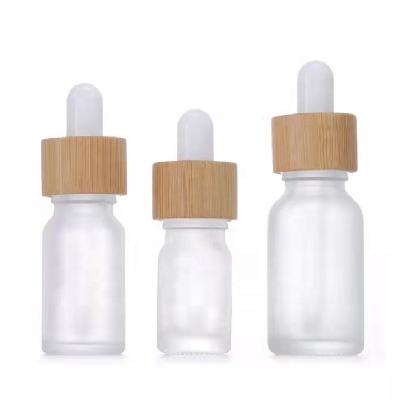 China 5ml 10ml 15ml 20ml 30ml 50ml 100ml Amber Essential Oil Glass Dropper Cosmetic Bamboo Top Bottle with dropper and your logo for sale