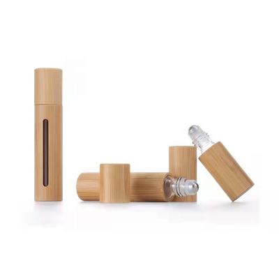 China 10ml Cosmetic Bamboo Shell Glass Roll On Bottles For Essential Oils With Stainless Steel Rollerballs Container for sale