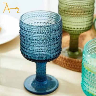 China Sustainable Embossed design glassware vintage wine goblets whiskey glasses cup colorful wine glasses carved water goblet for sale