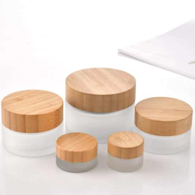 China Hot sale 50ml personal care glass box with bamboo and wooden cover cosmetic box for sale