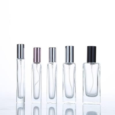 China Square Clear 10ml 30ml 100ml Personal Care 50ml Glass Perfume Bottle With Spray Gold And Sliver Cap for sale