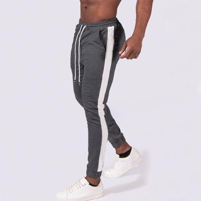 China Anti-Wrinkle Two Tone Color Block Joggers Men Hip Hop Gym Sport Wear Training Workout Fitness Retraining Joggers for sale