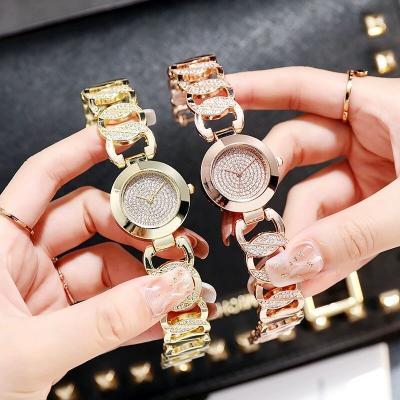 China 2022 Newest Fashion Gold Diamond Bracelet Watch Stainless Steel Luxury Brand Quartz Women Watch Simple Casual Women Watches for sale