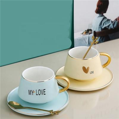 China New Design Top Quality Sustainable Home Using Beautiful Ceramic Coffee Mug With Golden Spoon for sale