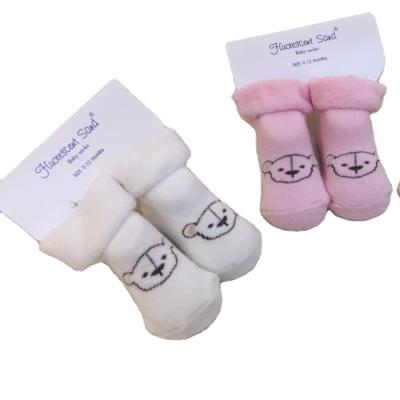 China Guangzhou Best Selling Viable 2021 Winter Solid Warm Baby Smile Baby Socks Handsome Socks for sale