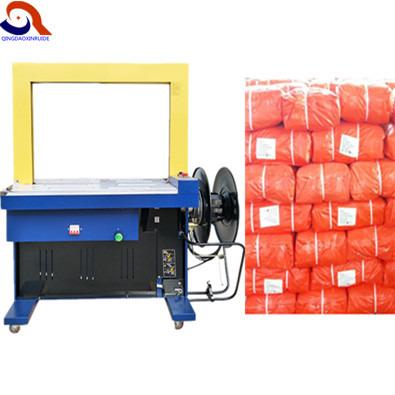 China High Speed ​​Automatic CLOTHING Grade PP Belt Banding Carton Tying Machine for sale