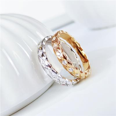 China Aimgal FASHIONABLE X Shaped CNC Hand Cut 18k Gold Plated Hand Set 3EX Zircon S925 Sterling Ring For Women for sale