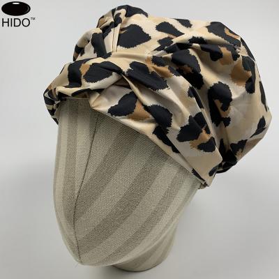 China Sustainable Custom Leopard Print Shower Cap For Women Waterproof Reusable Shower Cap With Bow for sale