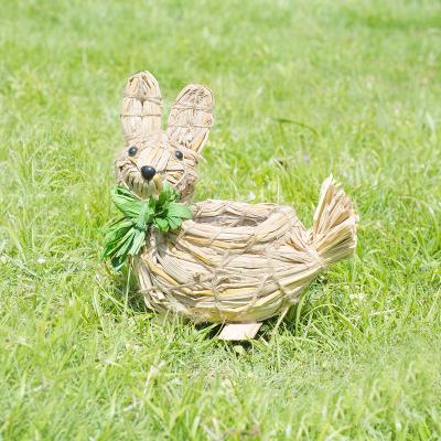 China Cute cartoon natural grass woven rabbit plant pots suitable for home and office flower potted plant pots for sale