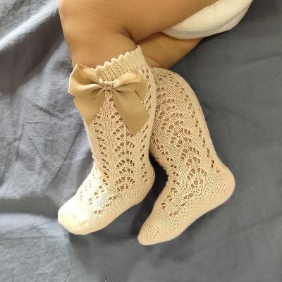 China QUICK DRY Girls mid-length stockings mid-size children hollow bowknot baby mesh socks for sale