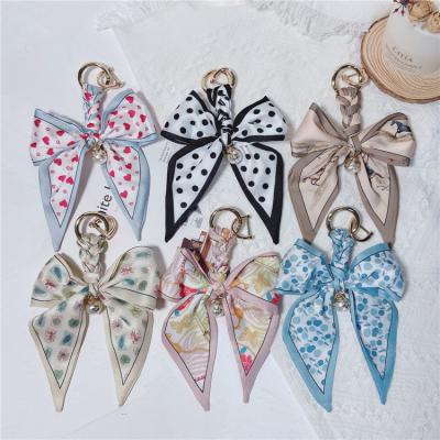 China New Fashion Woven Key Chain Ring Creative Lady Bag Pendant Net Red Car Fashion Bowknot Silk Scarf for sale