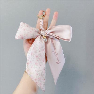 China Fashion Quality Ice Bow Key Chain Fashion Quality Ice Silk Scarf Woven Sexy Broken Female Bag Pendant Chain for sale