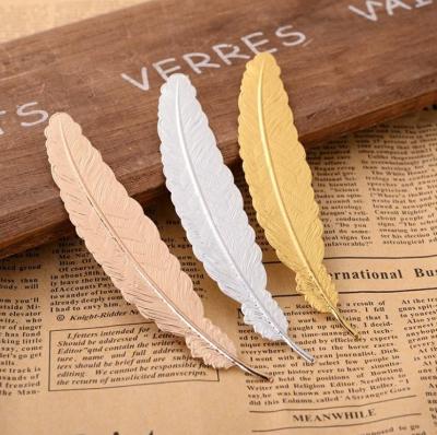 China Custom Creative Europe New Gifts Copper Bookmark Metal Feather 3d Bookmark for sale