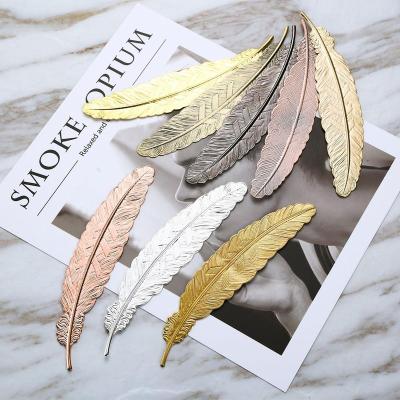 China Wholesale Europe Metal Feather Shape Bookmarks Assorted Book Marker For Adults And Children for sale