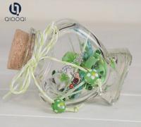 China 65ml Hot heart shape lucky star glass bottle à venda