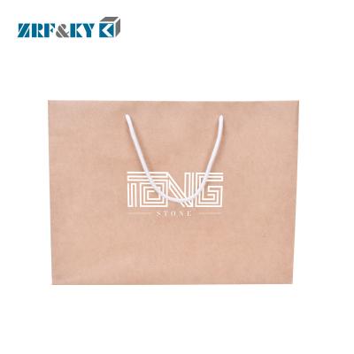 China Recyclable Custom Printed Brown Kraft Paper Shopping Bags with Cotton Handle for sale