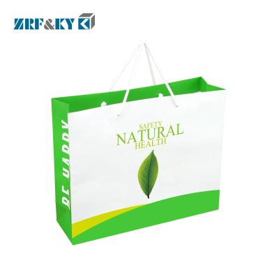 China Recyclable Custom Printed Recycled Paper Packaging Shopping Gift Bag With Your Own Logo for sale