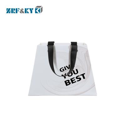 China Recyclable Custom Printed Trapezoidal Shaped Paper Shopping Bags with Rivet Handle for sale