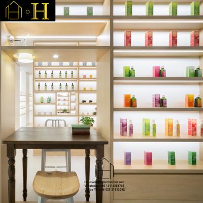 China Luxurious Wooden Cosmetic Shop Display Stand Makeup Kiosk Makeup Shop Display Eyebrow Cosmetic Display Cabinet for sale