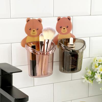 China Sustainable Little Bear Wall Mounted Storage Cup Draining Toothbrush Holder Sticking Bathroom Storage Cup for sale