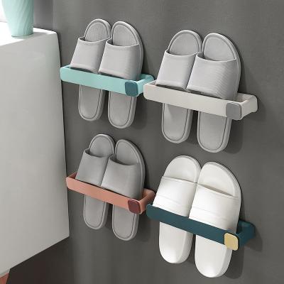 China Wholesale Price Viable Nordic Style Portable Adhesive Towel Rack Space Saving Slippers Stretch Wall Mounted Plastic Shoe Rack With Hook for sale