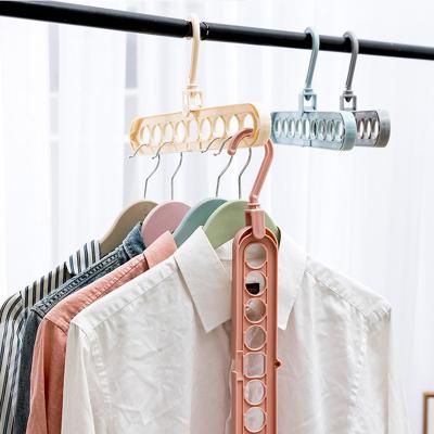 China Multifunctional Folding Space Saving Organizer Space Saving Daily Life 9 Hole Magic Hangers Drying Racks Plastic Clothes Hanger for sale