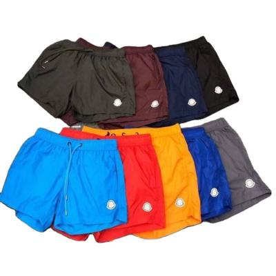 China Breathable Shorts Embroidered Logo Men Women Waterproof Beach Shorts Bungee Casual Loose Shorts for sale