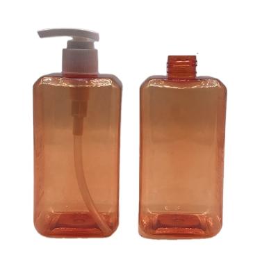 China Personal care 400ml cylinder plastic lotion bottle white pump glass orange color bottle for body lotion for sale