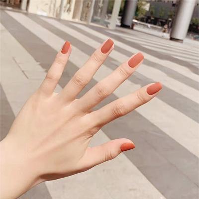 China Design Wearable Fake Nails 24 Matte White Manicure Nails Frosted Pumpkin Color Nails for sale