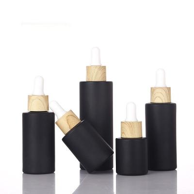 China 30ml matte black frosted plastic lotion bottle wood grain ring dropper bottle can be customized bottle 30ml for sale