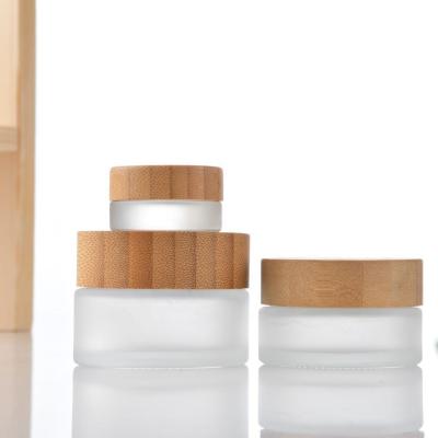 China Personal Care Made in China Custom Wooden Cream Grain Lid Multi-Specification Bottle to Cosmetic Cream Bottle Glass Bottles for sale