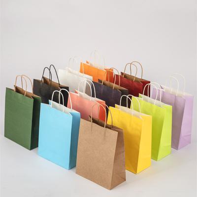 China Custom Logo Printed Brown Kraft Shopping Disposable Reusable Shopping Paper Bag With Handles for sale