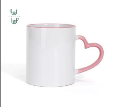 China Disposable Sublimation Blank Mug With Heart Hand Color Handle DIY Personalized Mugs for sale