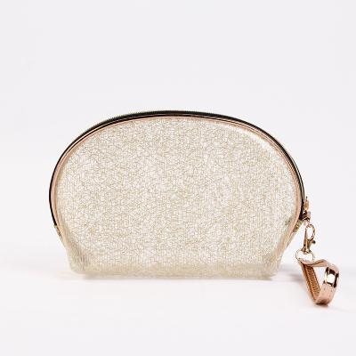 China Lady's new shiny gold silk semicircle high quality translucent cosmetic bag with handle zipper for sale