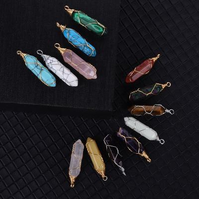 China Decoration Handwork Winding Copper Wire Crystal Double Headed Hexagonal Pendant Natural Stone Warhead Jewelry Gift for sale