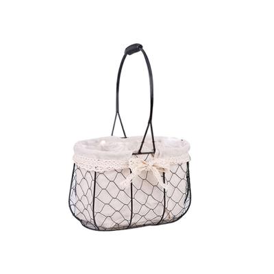 China Decorator Hollow Iron Craft Basket Flower Basket Sustainable Home Storage Basket for sale