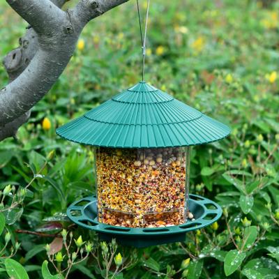 China Hot Selling Stocked Outdoor Plastic Bird Feeder With Waterproof Hanging Roof Food Container Bird Feeder for sale