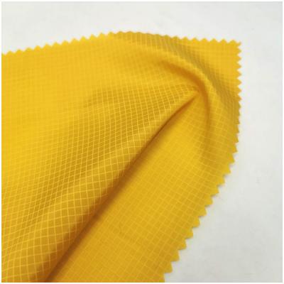 China Customized wholesale waterproof dyed 100% waterproof taffeta fabric polyester grid taffeta fabric for garment for sale