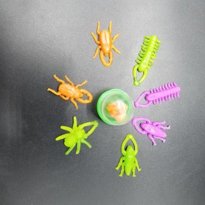 China Capsule Toys 1 Inch Capsule Promotion Toys Kids Plastic TPR Mini Slingshot Flying Insect Toy Small Catapult Toys for sale