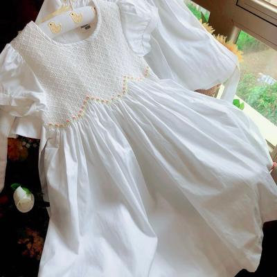 China Girls Washable Smocked Clothing White Smocked Dress Heavy Industry Sheer Hand Gather Show Embroidered Bow Round Neck Short Sleeve for sale