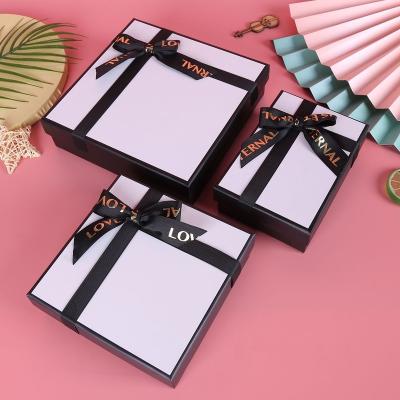 China Custom Personalized Biodegradable Ribbon Box Kraft Paper Gift Rigid Paper Packaging Boxes For Clothes for sale