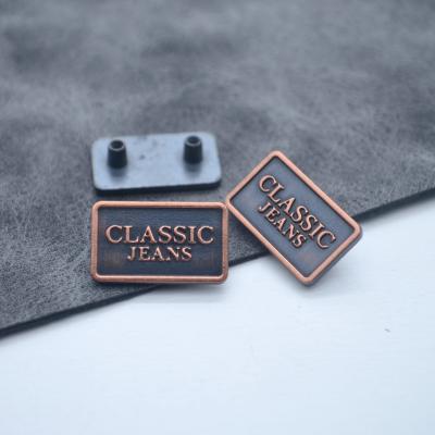 China Viable Wholesale Custom Engraved Brand Logo Plate Labels Metal Metal Apparel Tags For Handbags Clothing for sale