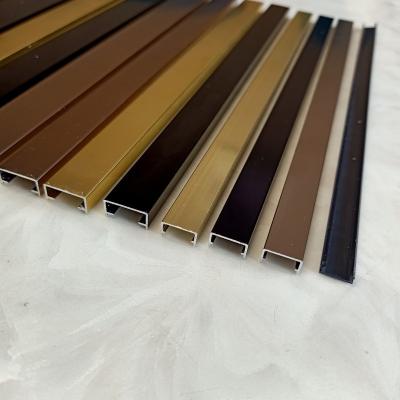 China Minimalist luxury modern U shape mastic black decoration strips tile self-adhesive gap aluminum strip tile repeater for sale