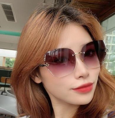 China fashion sunglasses china manufacturer wholesale private label polarized gold metal round diamond rimless sunglasses for sale